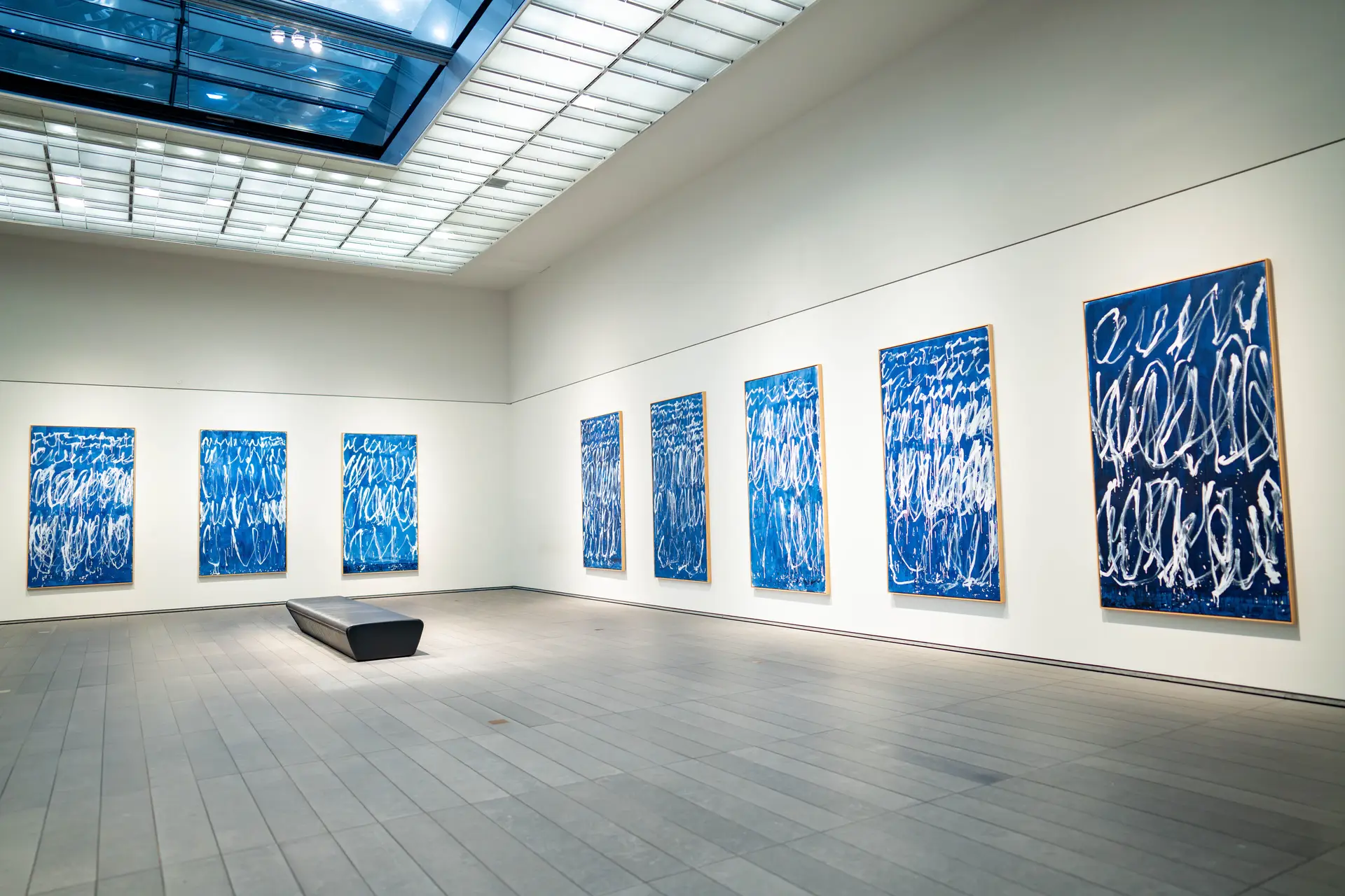 Minimalist contemporary art gallery interior with abstract paintings
