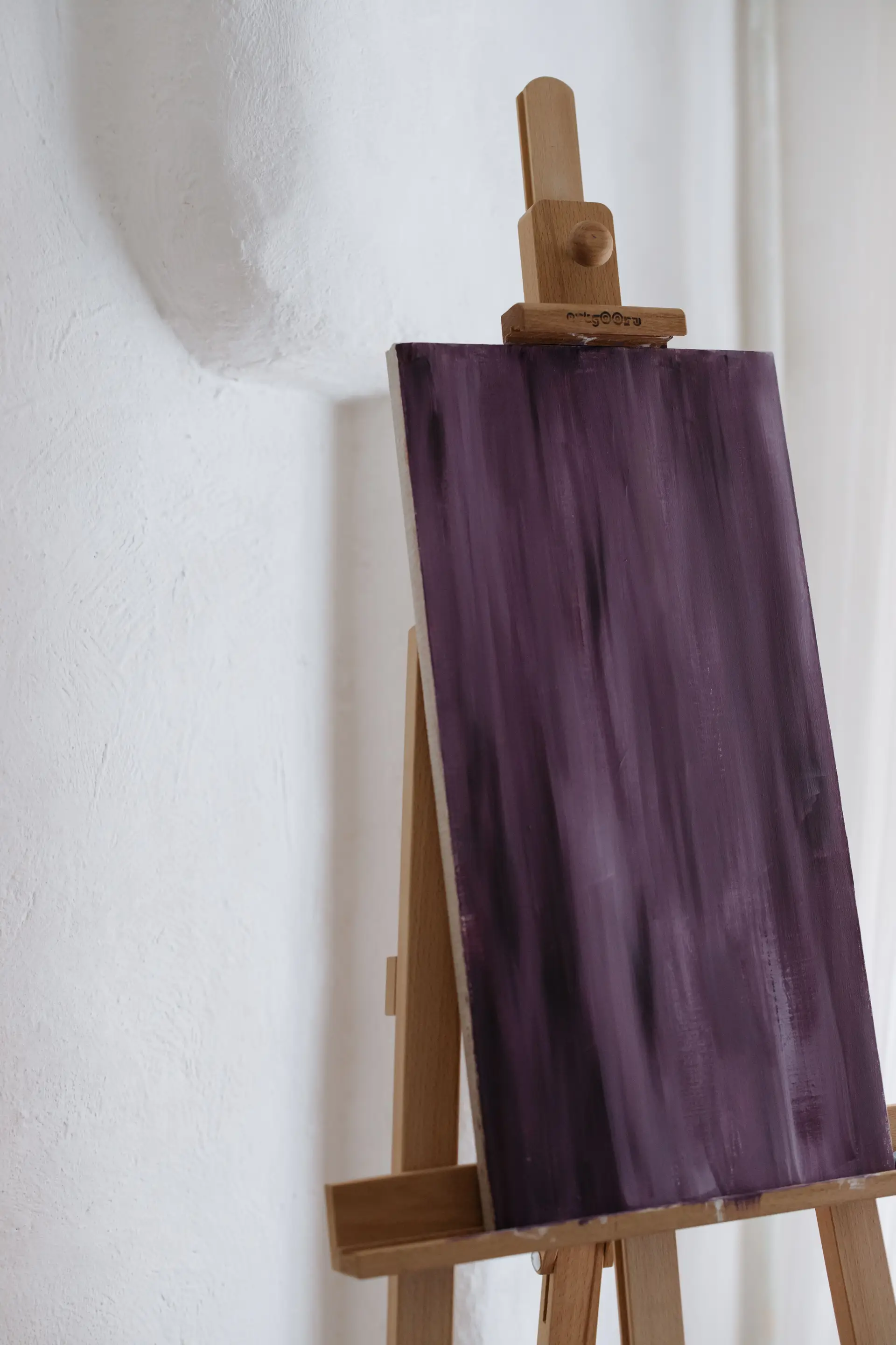 Abstract purple painting on easel